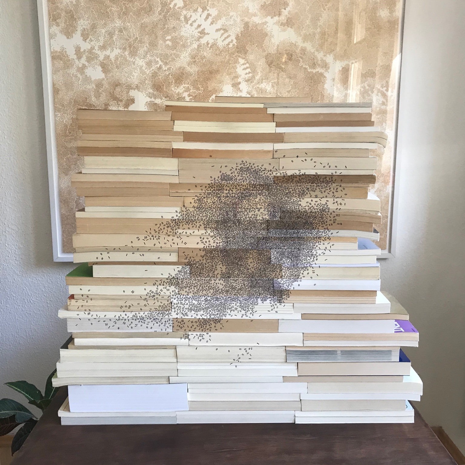 A pile of books with stamps of ones and zeros