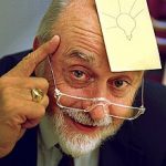 Arthur Fry, inventor of the Post-it Note, with one on his forehead bearing a with a picture of a lightbulb